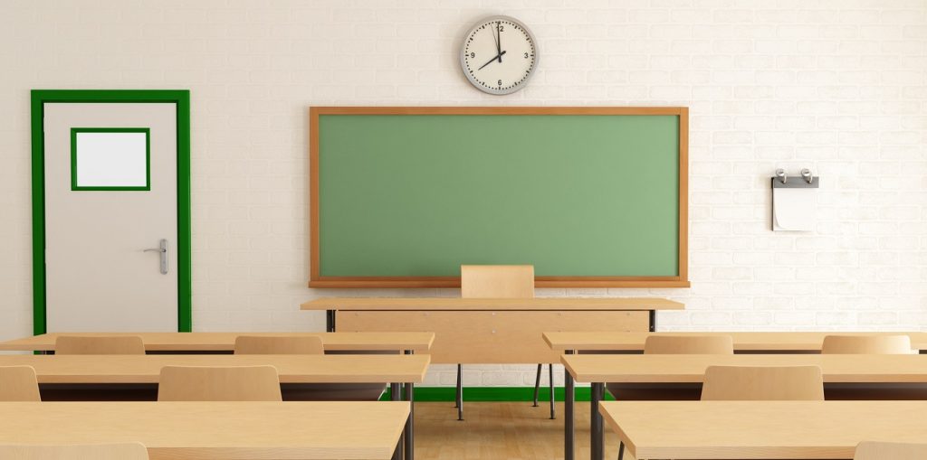 Classroom without students with wooden furniture and green blackboard on brick-wall-rendering